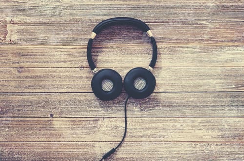 Preview: Headphones On A Wooden Desk Overhead View