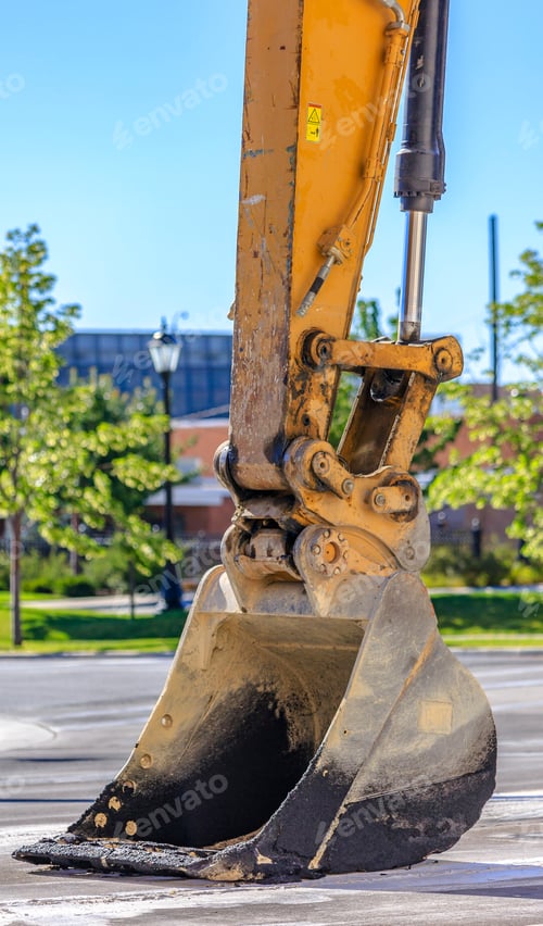Preview: Close Up Of Tractor Scooper In City Streets