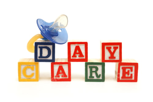 Preview: An Infants Pacifier Next To The Words Day Care.