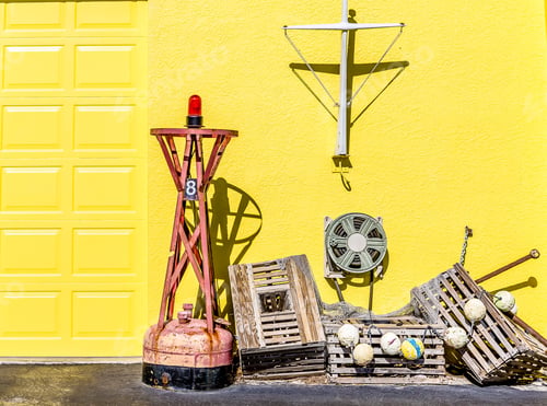 Preview: Old Lobster Traps By Yellow Wall In Coastal Village