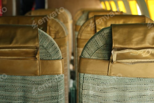 Preview: Back Of Several Seats On An Abandoned Airplane. Natural Light Coming From Plane Windows.