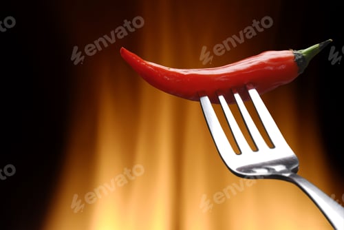 Spicy Red Pepper on a Fork with Flames