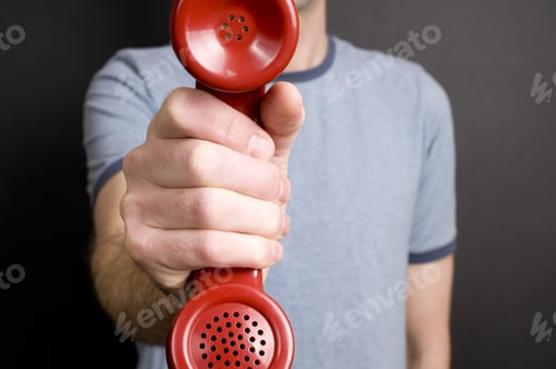 Preview: A Man In The Background Holding A Phone Receiver.
