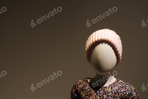 Preview: Small Faceless Mannequin Wearing A Winter Hat. Off Center.