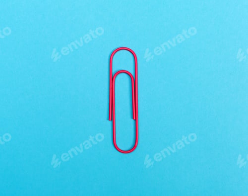 Preview: Big Paper Clip On A Bright Blue Background