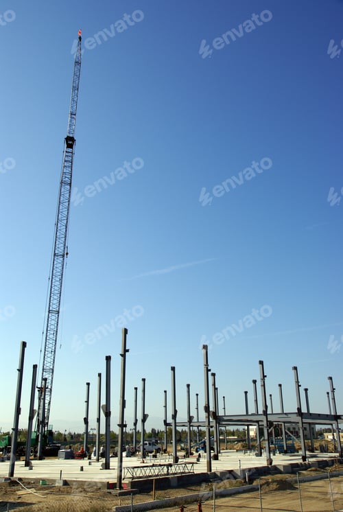 Preview: Cranes Are Used In The Erection Of Steel Columns At A Construction Job Site