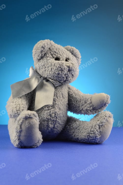 Preview: A Fluffy Blue Teddy Bear Over A Complimenting Background.