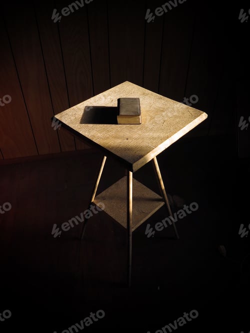 Preview: Tiny Book On A Small Table. Natural Light With Dark Edges.