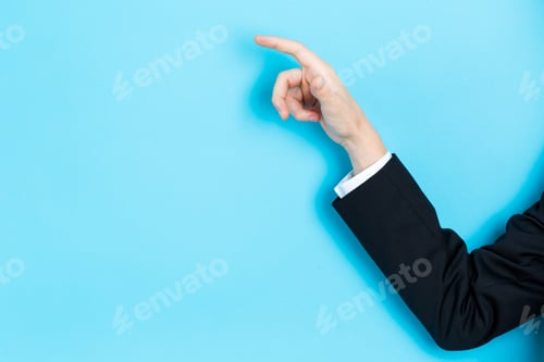 Preview: Businessman Pointing His Finger On A Blue Background