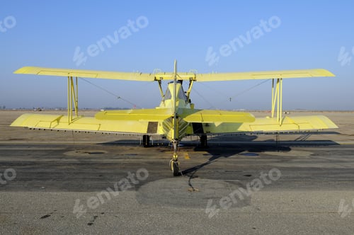 Preview: Yellow Crop Duster Biplane With Spray Nozzles Mounted On Wing Trailing Edge