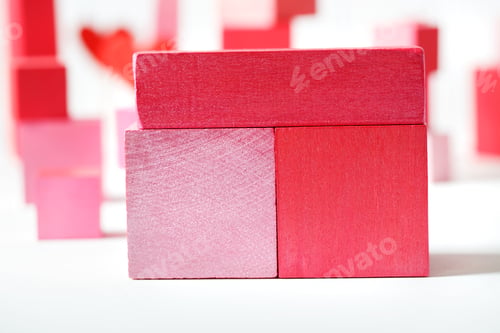 Preview: Colorful Red And Pink Wooden Blocks On White Background