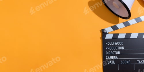 Preview: Movie Slateboard Clapper With Megaphone On A Orange Background