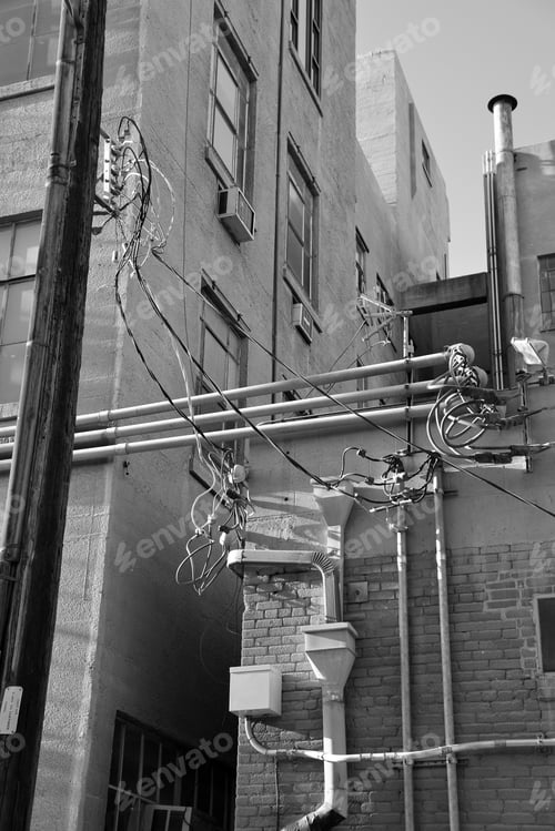Preview: An Urban Alley Shows Electronic And Electrical Modifications Made Over The Years Resulting In A