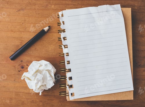 Preview: Note Book And Pencil With Crumpled Paper On Wooden Background