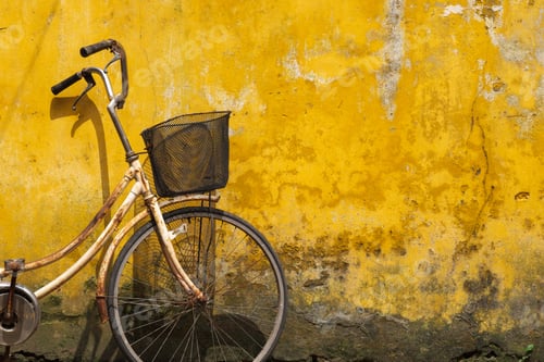 Preview: Old Bicycle Against Old Yellow Wall On A Street Of Hanoi Old Town, Vietnam.