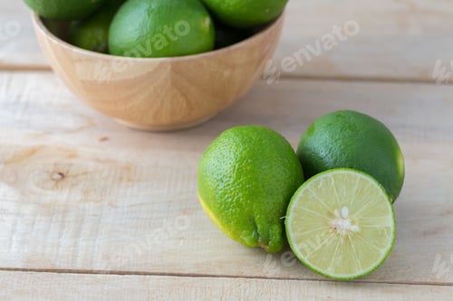 Preview: Green Lemon On Wooden Background