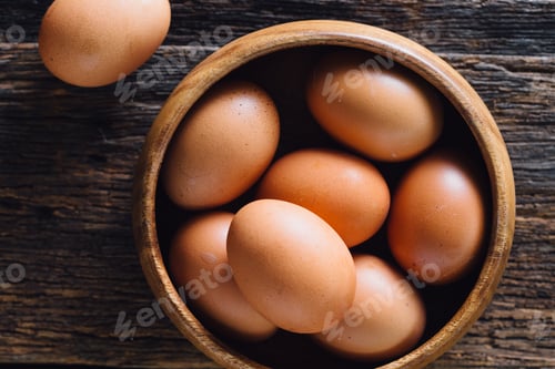 Preview: Eggs In Wooden Cup On Wooden Background
