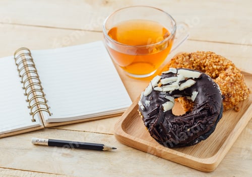 Preview: Doughnuts and Tea on a Wooden Table