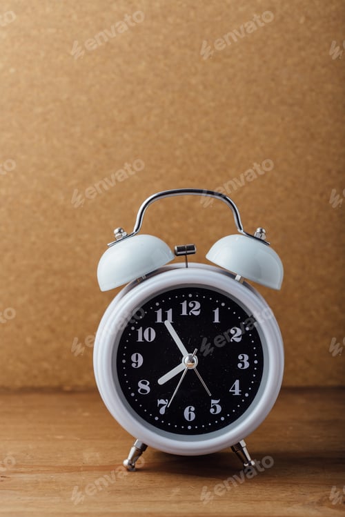 Preview: White Alarm Clock On Wooden Background