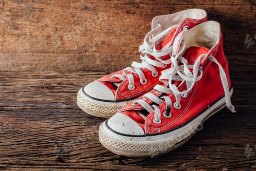 Preview: Red Sneakers On Wooden Floor With Wooden Background