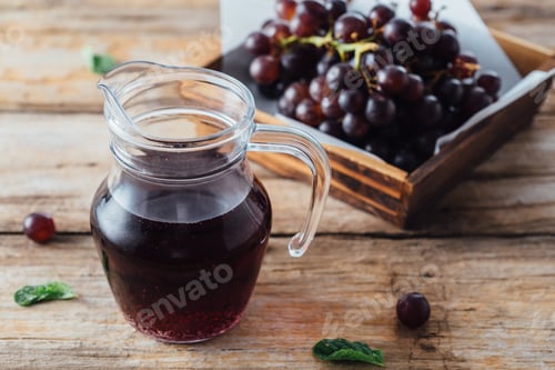 Preview: Grape Juice On Wooden Table Background