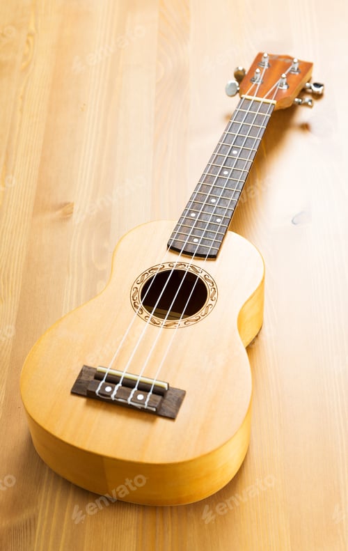 Preview: Ukulele On Wood Background