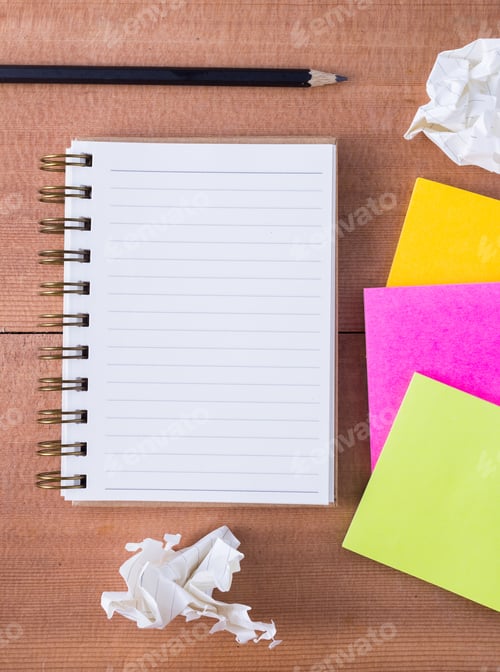 Preview: Note Paper And Note Book With Crumpled Paper On Cork Board Background