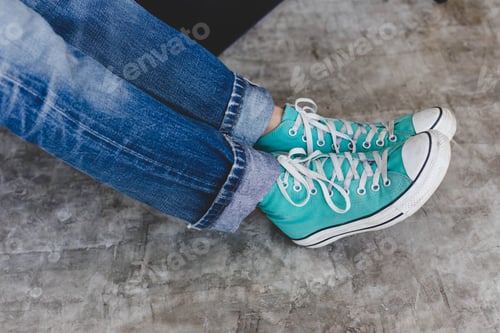 Preview: Blue Sneakers On Cement Floor In A Holiday