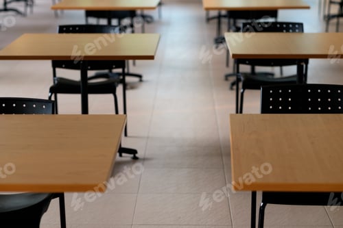 Preview: Tables And Chairs That Is Arranged Spaced Or Social Distancing In The Dining Room Without People.