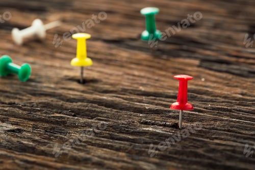 Preview: Pins On Wooden Table Background