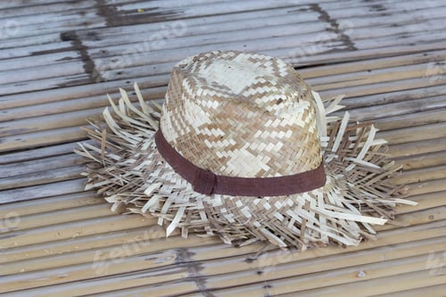 Preview: Woven Hat with Brown Band on Bamboo Surface