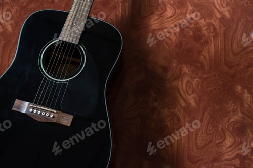 Preview: Black Acoustic Guitar On Wood Tiles Background