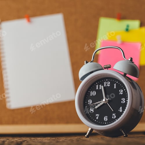 Preview: Alarm Clock With Paper Note On Cork Board Background, On Wooden Table