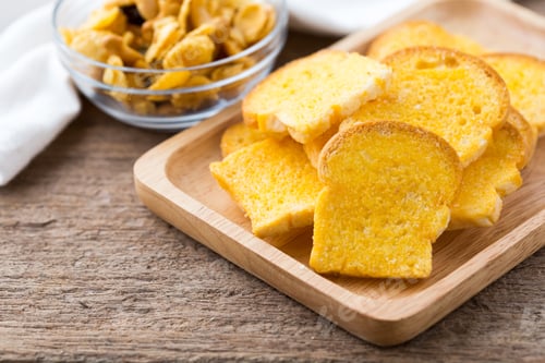 Preview: Slices Of Fresh Baked Bread,Bread Crisp With Corn Flakes On Wooden Table