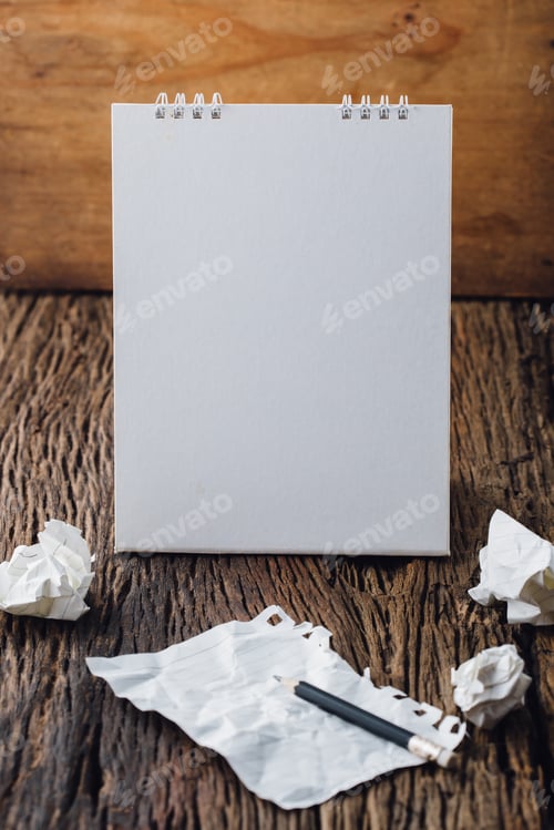 Preview: Desktop Calendar With Crumpled Paper And Pencil On Wooden Floor