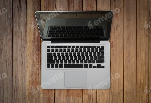 Preview: Open Laptop With Isolated Screen On Old Wooden Desk.