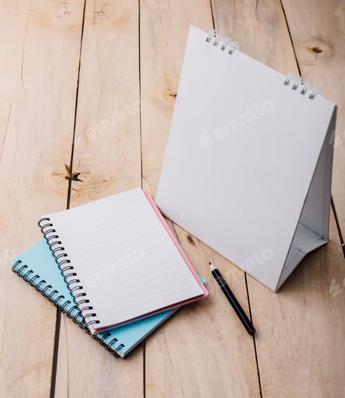 Preview: Desktop Calendar And Cup With Note Book On Wooden Table