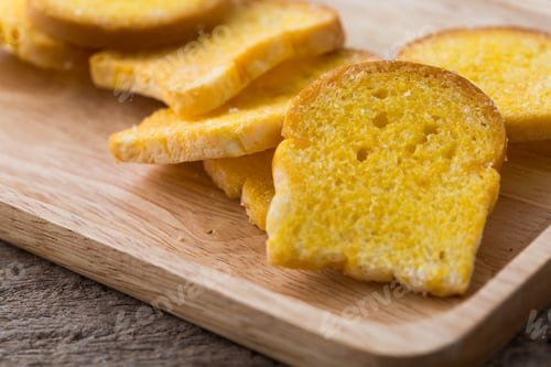 Preview: Slices Of Fresh Baked Bread On Wooden Table