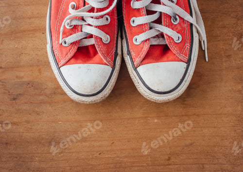 Preview: Red Sneakers On Wooden Background