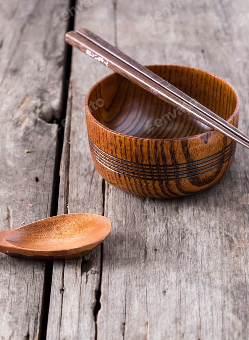Preview: Wooden Bowl, Spoon, and Chopsticks on Rustic Table