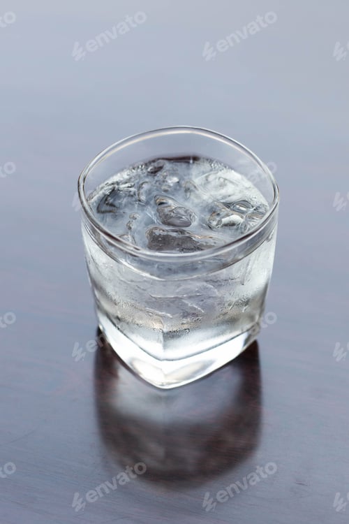 Preview: Glass Of Water On Wooden Table