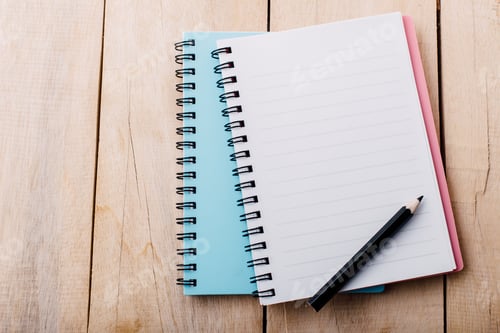 Preview: Notebook and Pencil on Wooden Surface