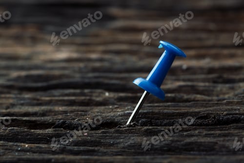 Preview: Pins On Wooden Table Background