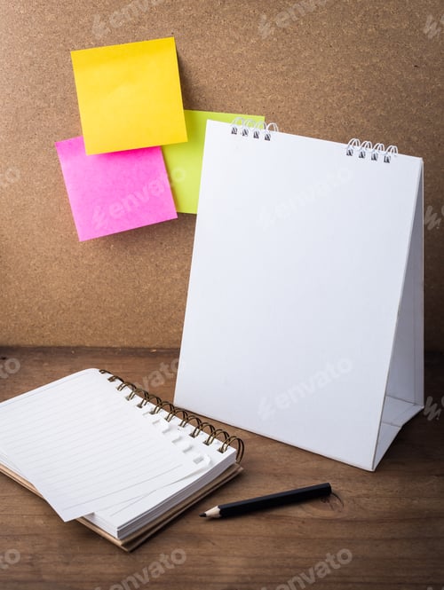Preview: Desktop Calendar And Note Book With Note Paper On Wooden Background