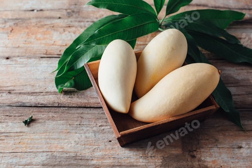 Preview: Mango On Wooden Background