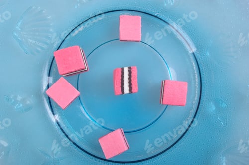 Preview: Pink White And Black Licorice On Plate