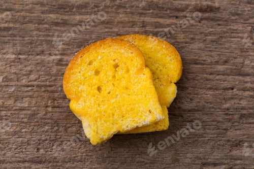 Preview: Slices Of Fresh Baked Bread On Wooden Table