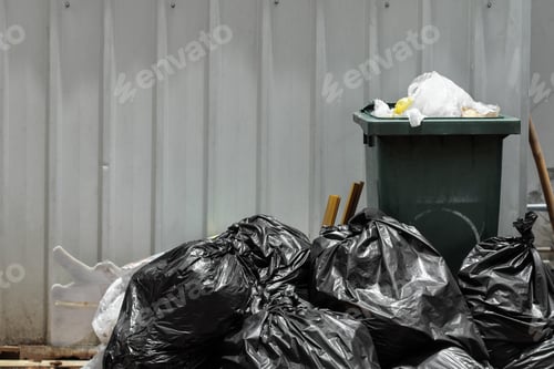 Preview: Green Garbage Bin With Black Garbage Bags.