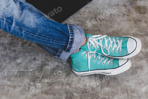 Preview: Blue Sneakers On Cement Floor In A Holiday