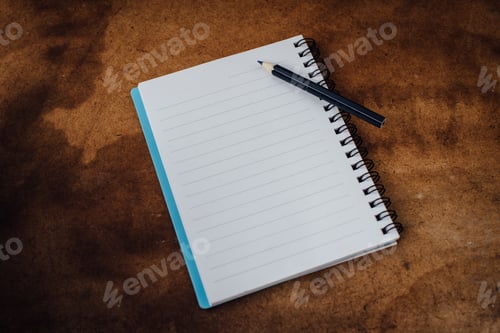 Preview: Note Book And Pencil On Wooden Floor